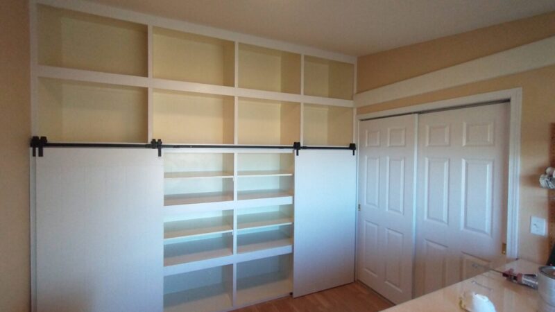 Custom barn doors for craft room shelving unit