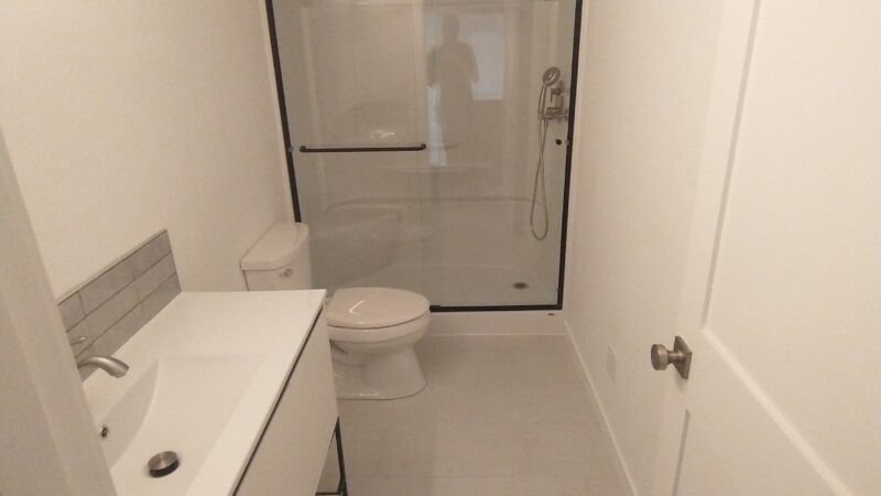 Bathroom remodel with grey tile